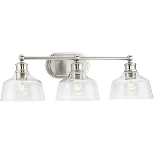 Singleton Collection Three-Light 26.5" Brushed Nickel Farmhouse Vanity Light with Clear Glass Shades
